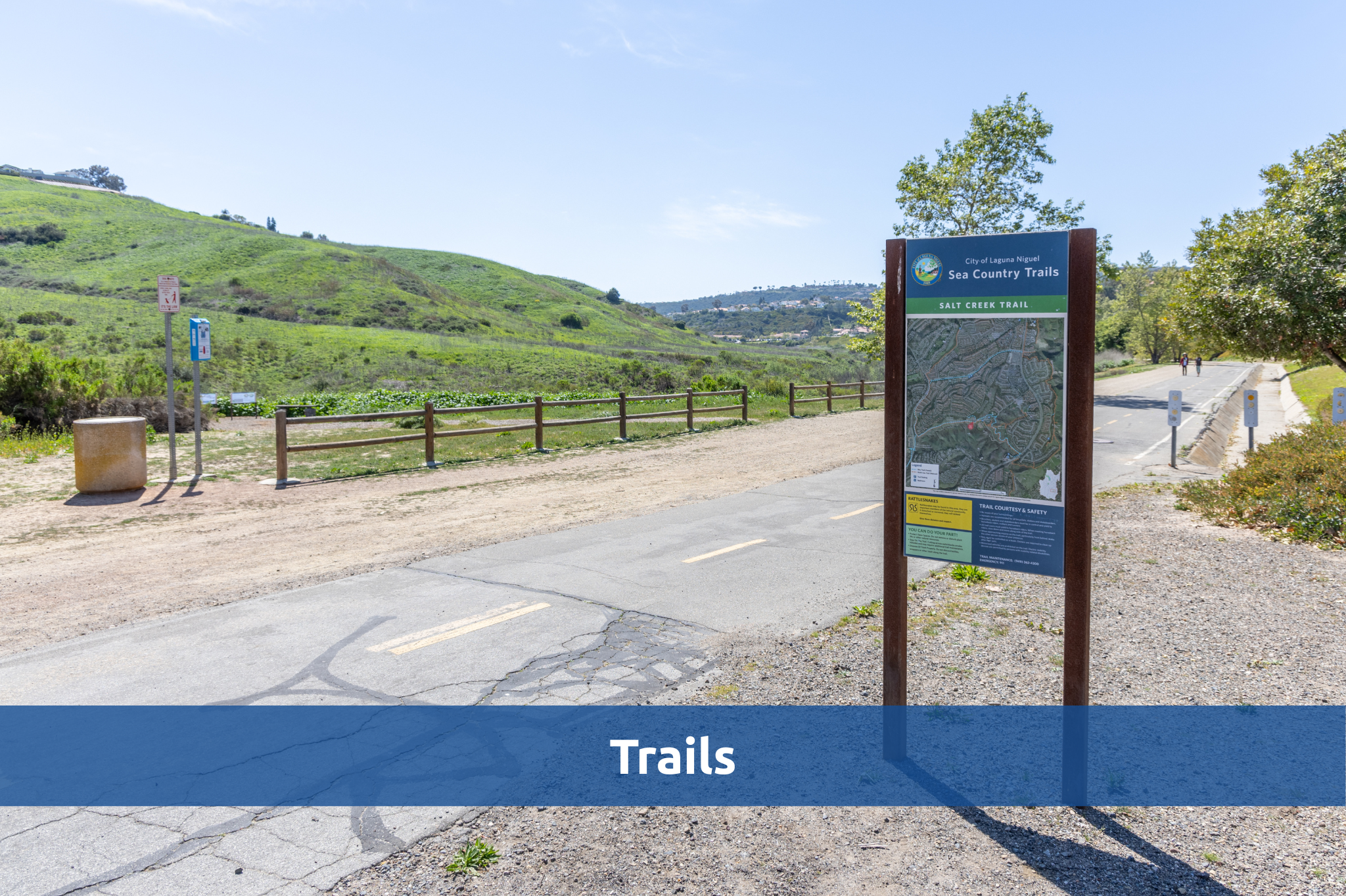 Salt Creek Trail sign and trail with hills in the background